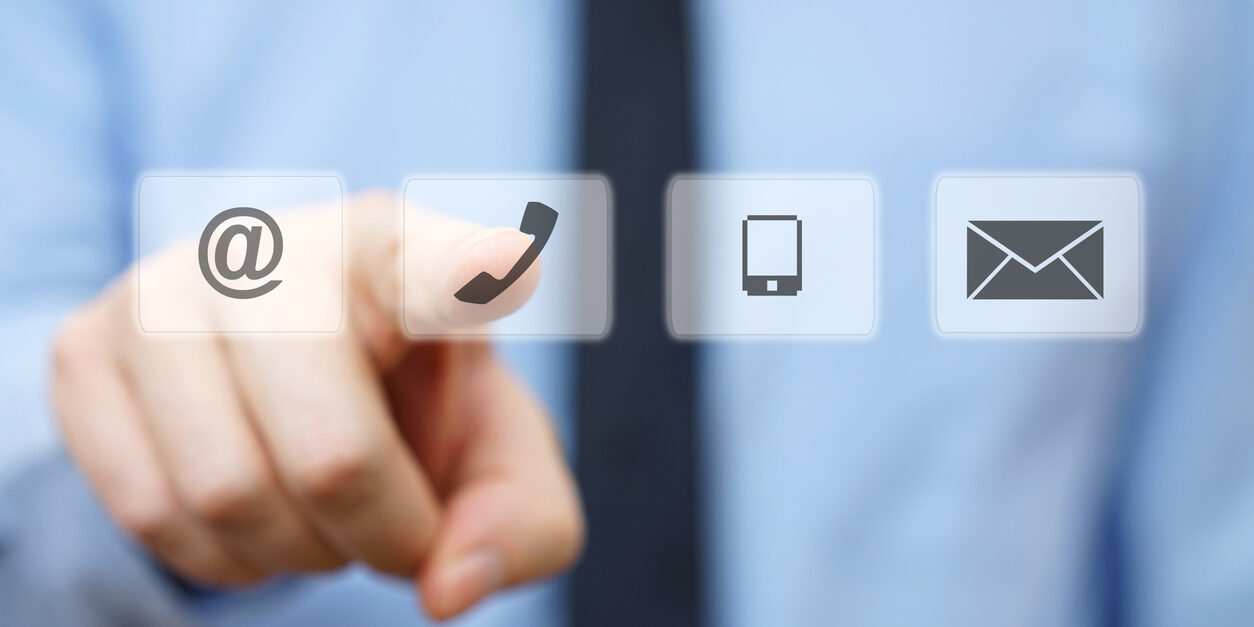 businessman pressing phone button, company identification icons